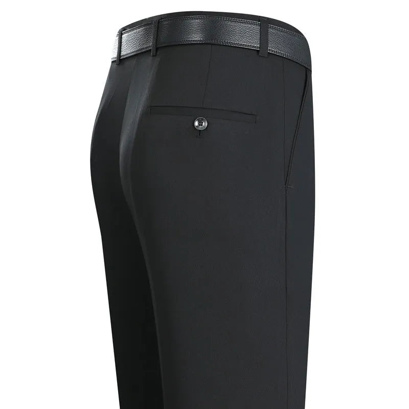 Men's straight-leg suit trousers in a dark blue colour, showing high waist and business cut.