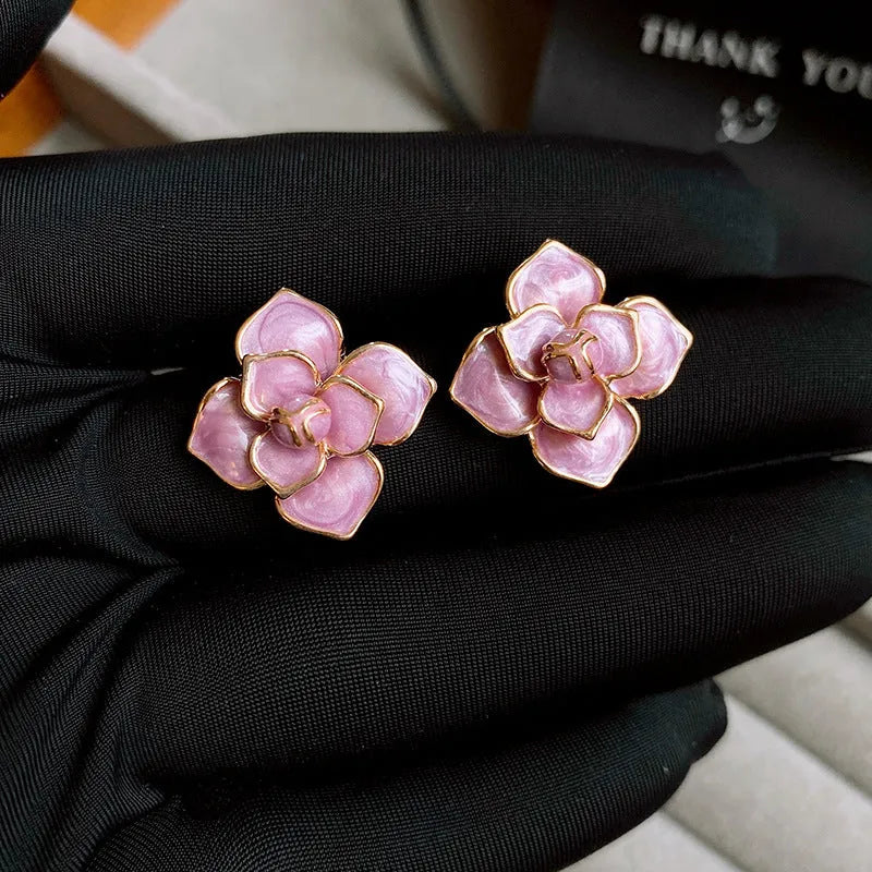 Gold-plated purple flower stud earrings with oil-spot glaze effect on copper material