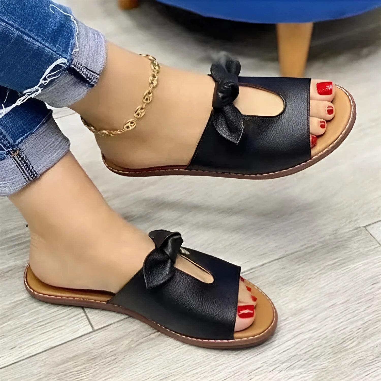 Women's fish mouth style sandals with a bow detail on the upper in black, pink, and gold colours