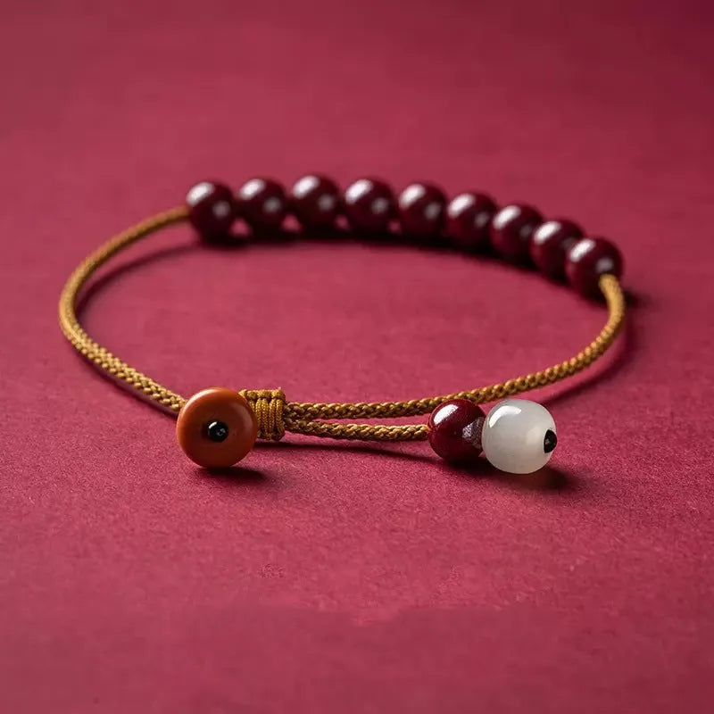 Hand-woven cinnabar bracelet with geometric design and traditional Chinese style