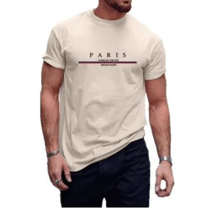 Man wearing a loose-fit short-sleeved t-shirt with a large letter print on the chest in a solid colour.