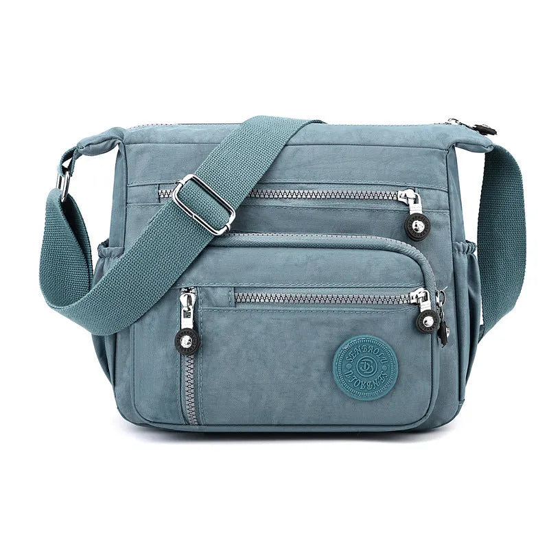 Gray nylon shoulder messenger bag with square vertical design and single strap