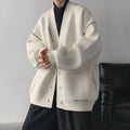Women's black knitted cardigan top coat with long sleeves and loose fit