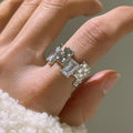 Silver geometric cross ring with zircon detailing and open gemstone setting