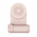 Black multifunctional magnetic phone camera holder with ergonomic PU leather grip on a table.