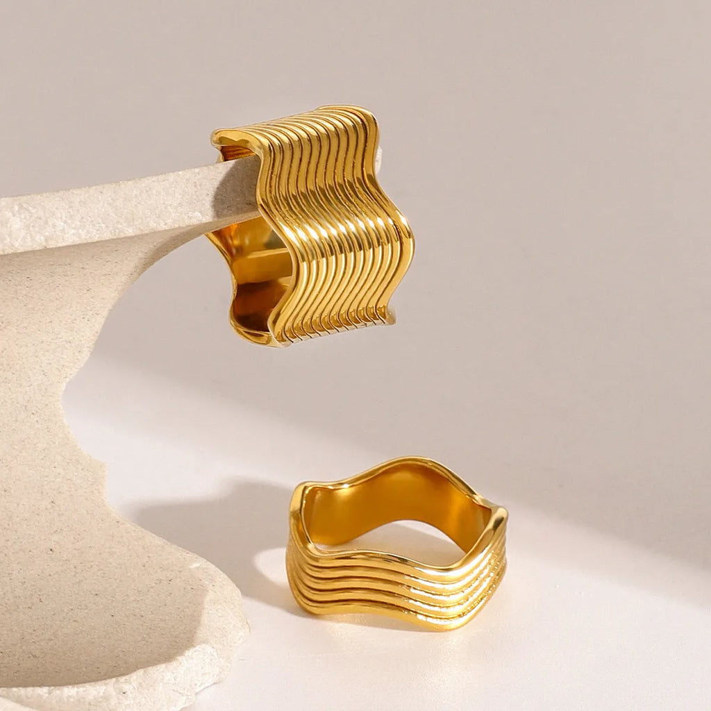 Stainless steel geometric wave ring with a wide surface, Korean-style women's fashion jewellery.