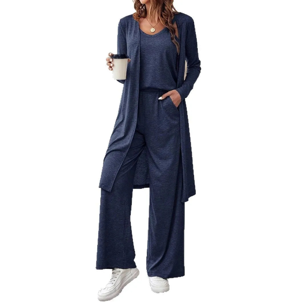 Blue women's three-piece trouser suit set with long cardigan on a hanger.