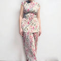 Long sleeve printed high-waist chiffon dress set with matching top and skirt on a model.