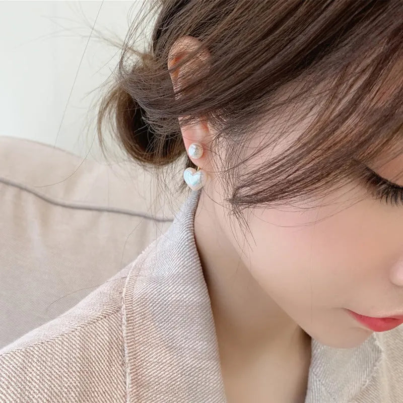 Korean style heart-shaped women's stud earrings with pearl design and alloy construction