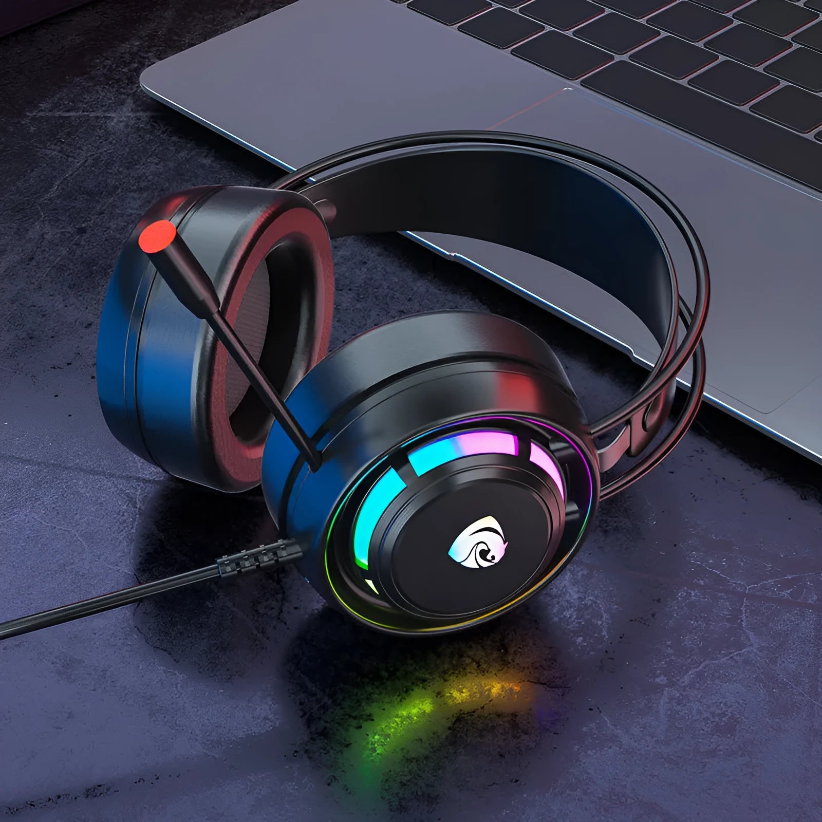 Black wired over-ear gaming headset with microphone and long cable, showing 50mm drivers and foam ear cushions.
