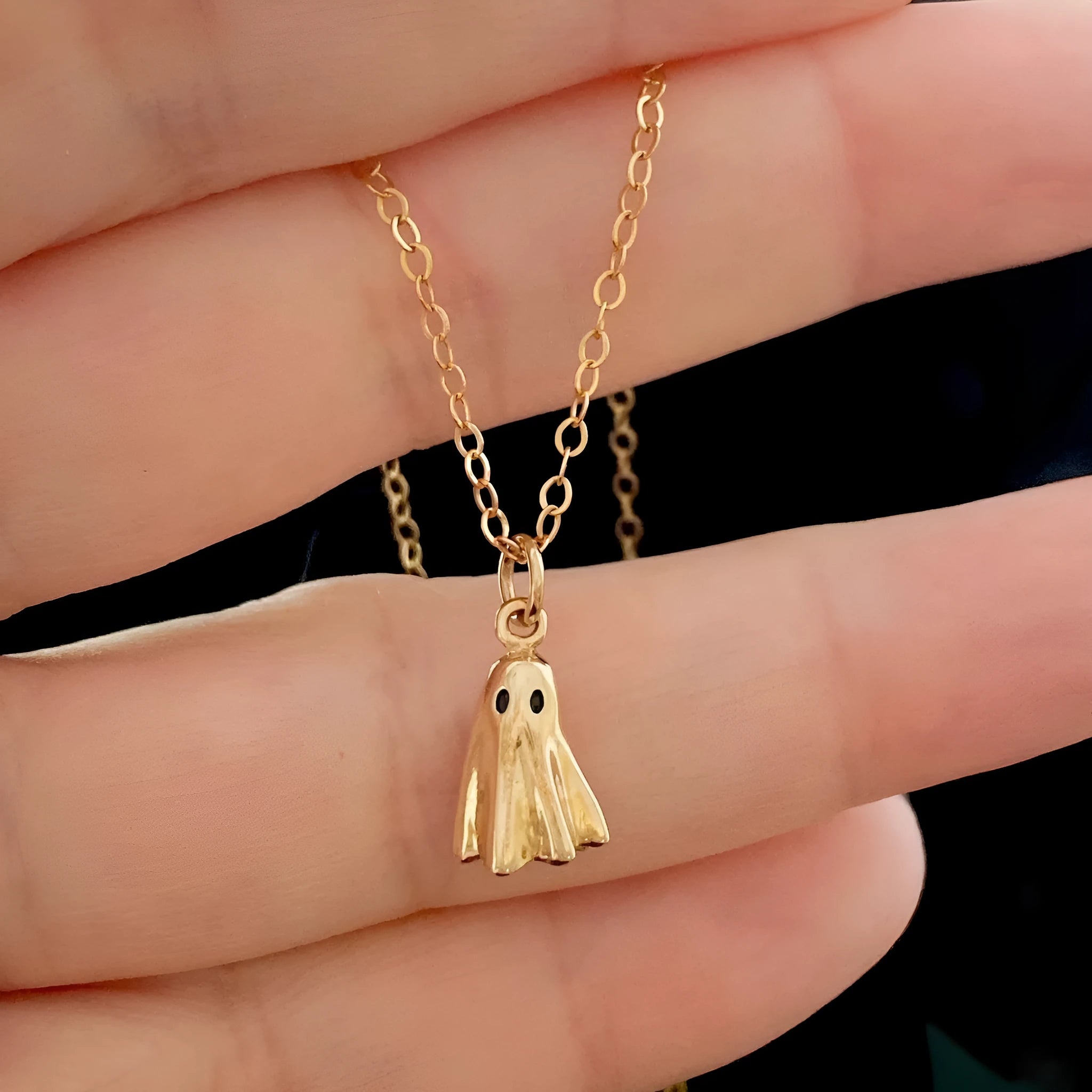 Stainless steel ghost pendant necklace with electroplated titanium steel centrepiece on twisted chain