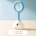 White blue and beige coloured cloud jaw design dog pooper scooper on a green lawn.