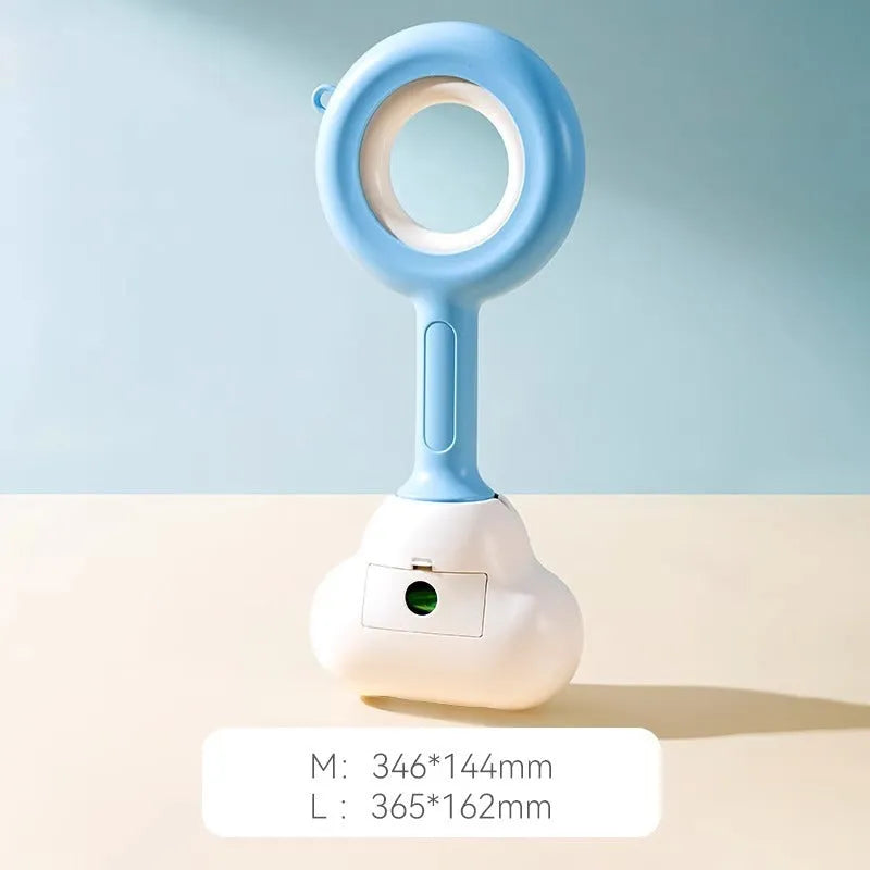 White blue and beige coloured cloud jaw design dog pooper scooper on a green lawn.