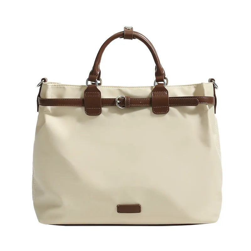 Women's nylon tote bag in creamy white with multiple internal pockets and three shoulder straps.