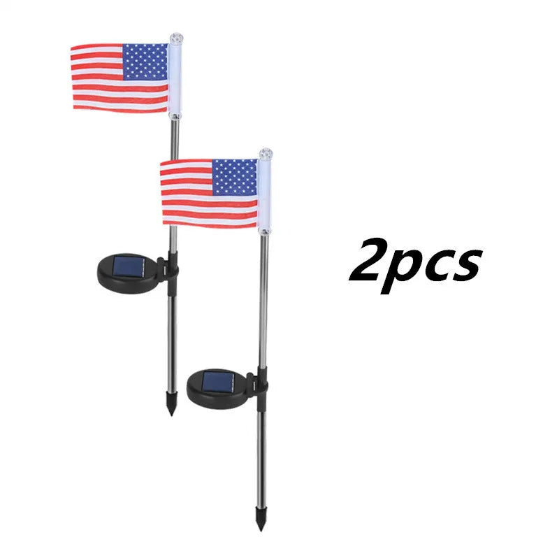 Solar garden flag light with stainless steel pole showing American flag design illuminated by white LEDs