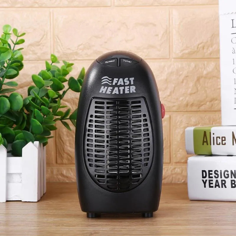 Black compact ceramic heater with digital display and rotating plug on desk