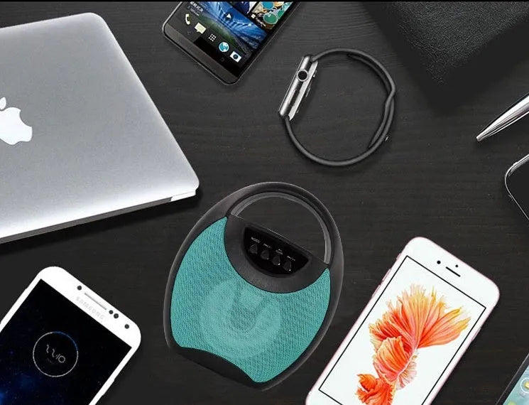 Portable Bluetooth speaker in black, blue, or pink colours showing USB port and SD card slot