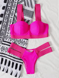 Women's rose red bikini with push-up support and separate pants laid flat.