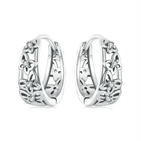 Sterling silver S925 retro hollow butterfly earrings with zircon details on a white background.