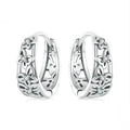 Sterling silver S925 retro hollow butterfly earrings with zircon details on a white background.
