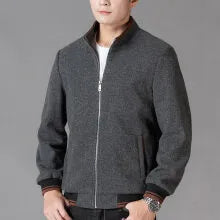 Men's grey polyester fleece sports jacket with long sleeves and a stash pocket on the chest.