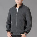 Men's grey polyester fleece sports jacket with long sleeves and a stash pocket on the chest.