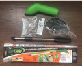 Cordless lawn trimmer with extension pole and protective shield on grass