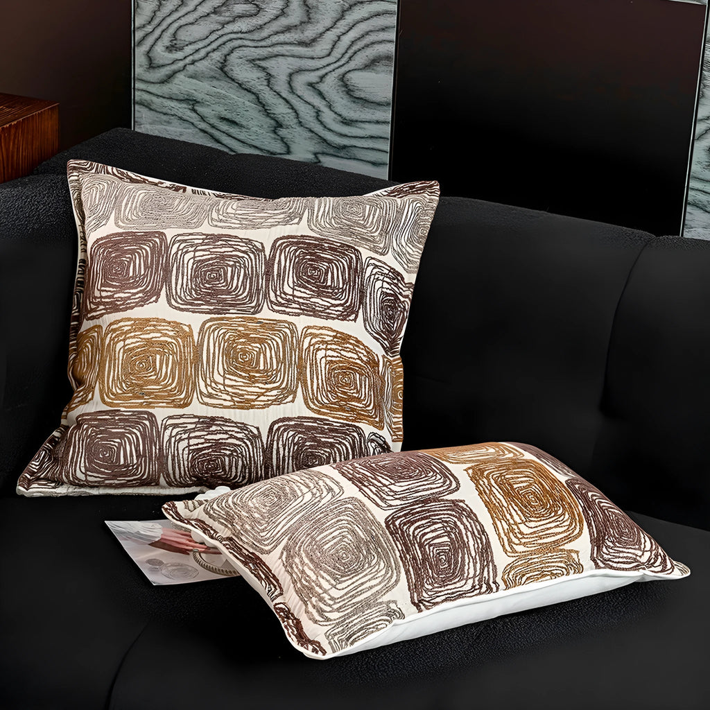 Cream and coffee-coloured abstract coil pattern pillow cover shown in square and rectangular sizes