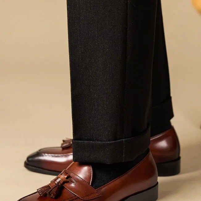 Men's black tassel loafers with genuine leather upper and British style detailing