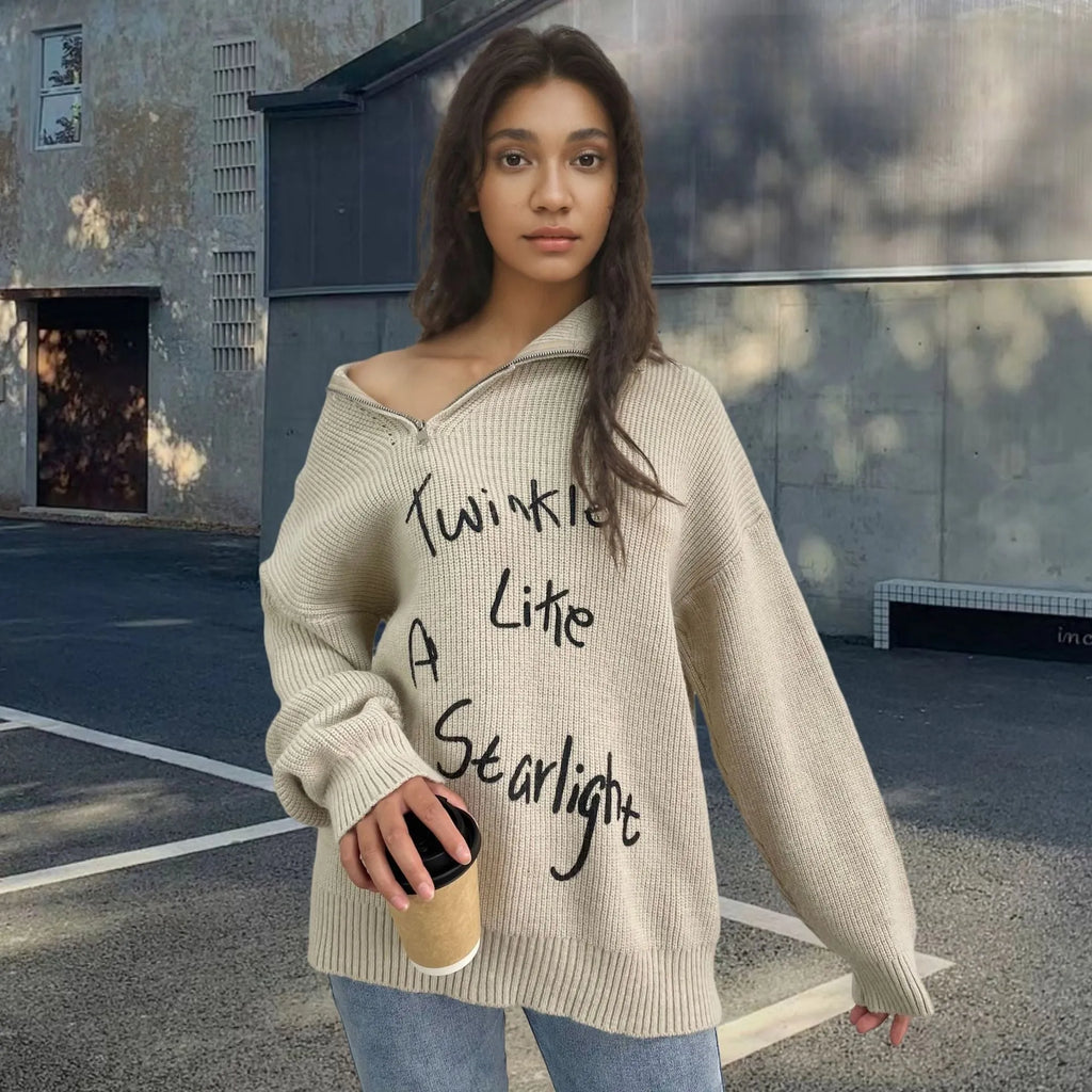 Light khaki women's alpaca wool sweater with oblique zip, turtleneck, and loose lapels.