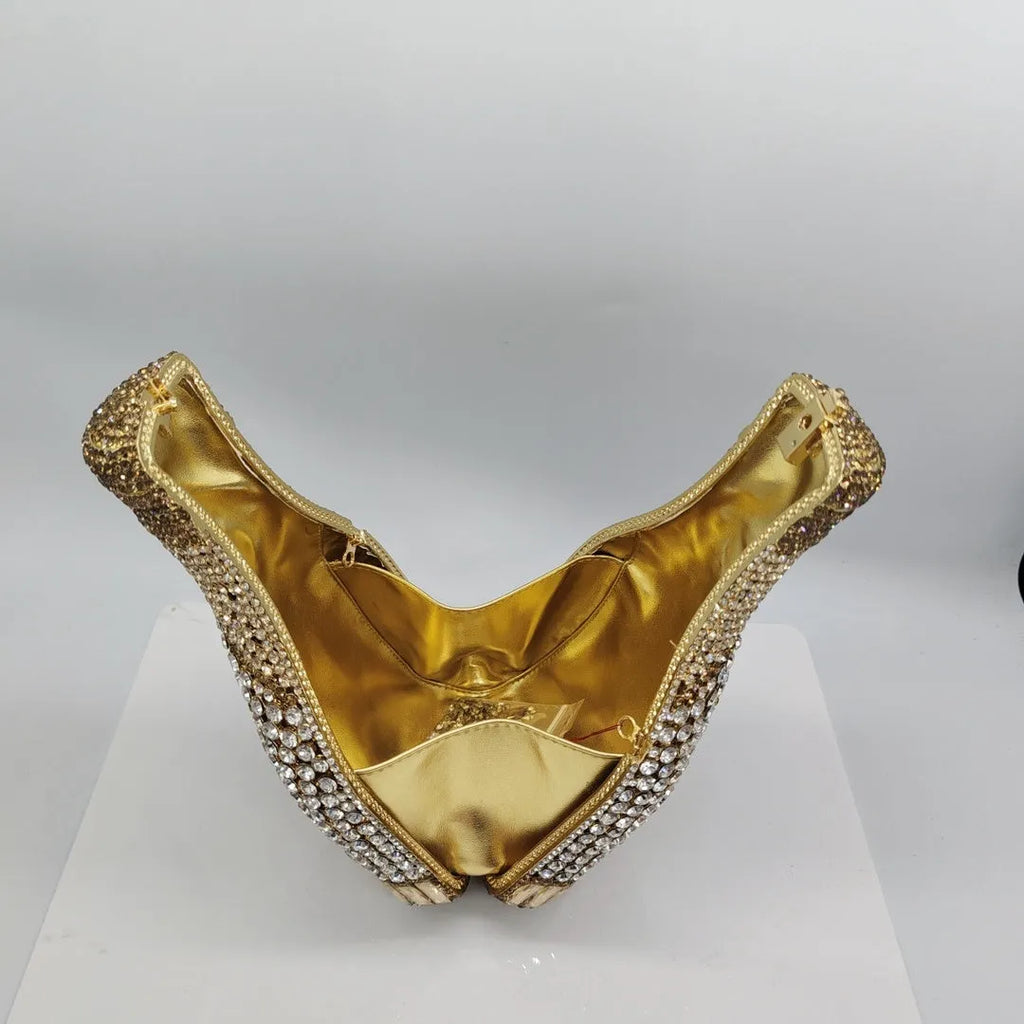 Gold champagne bottle shaped clutch bag with rhinestone detailing and alloy construction