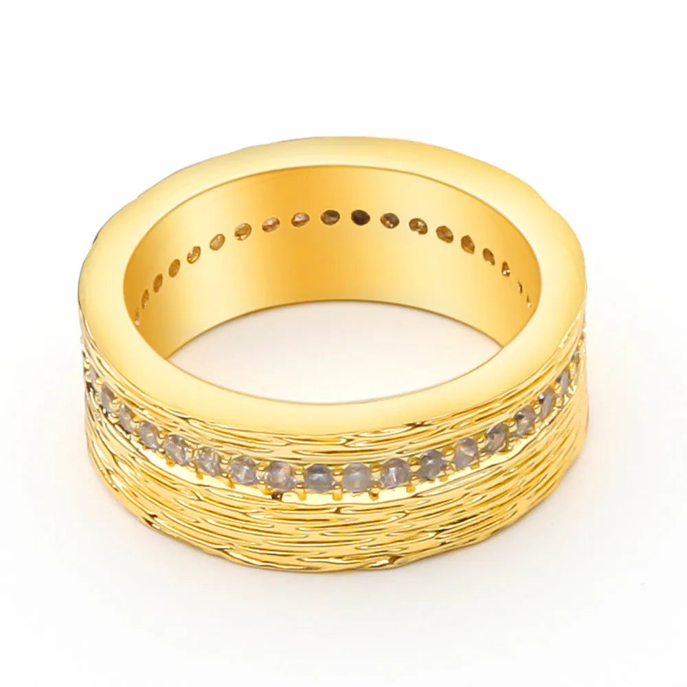 Gold geometric zircon ring on display showing angular design and available UK sizes 6-8