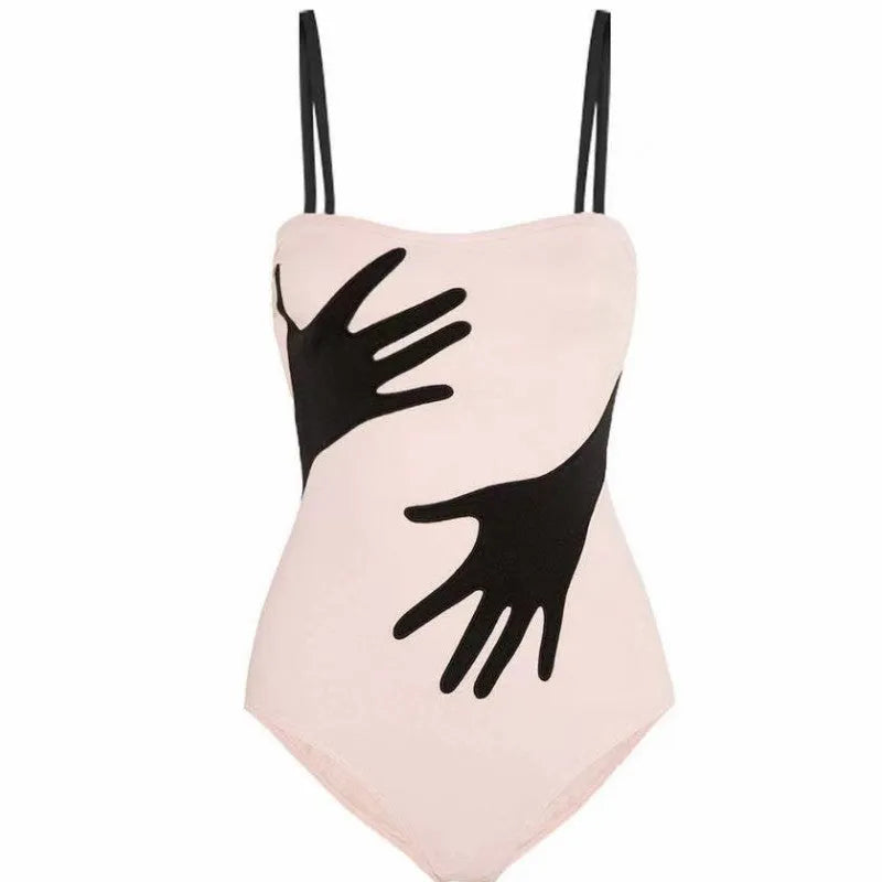 Women's one-piece swimsuit bikini with a sheer gauze skirt overlay.