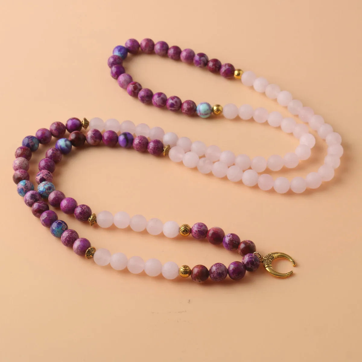 Round Emperor Stone necklace pendant with pink crystal detailing on chain
