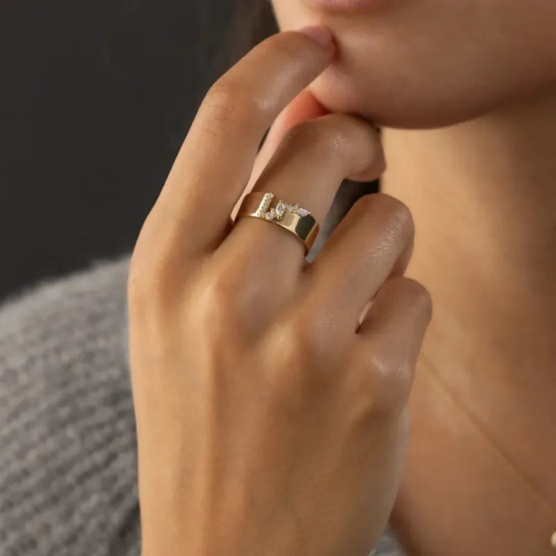 Gold electroplated copper ring with shining zircon details showing side profile view