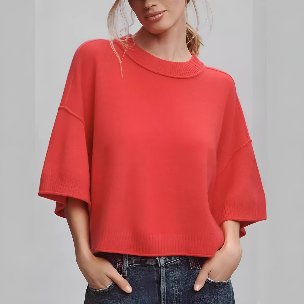 Red cropped short sleeve T-shirt with an exposed navel design on a mannequin.