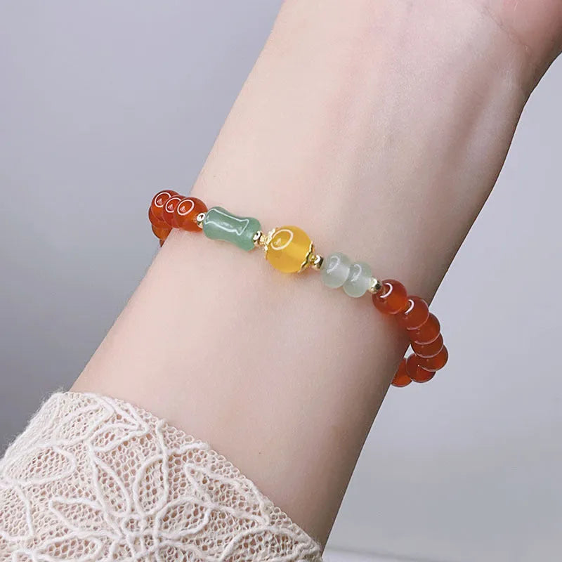Handcrafted red agate bracelet for women with dragon charm, Chinese style design.