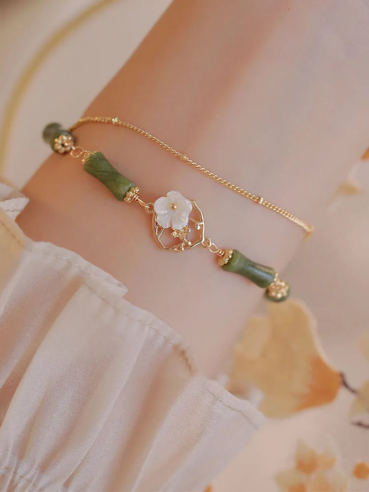 Handmade natural olivine bracelet with double layer Twin Bells of Ireland design and olive branch elements