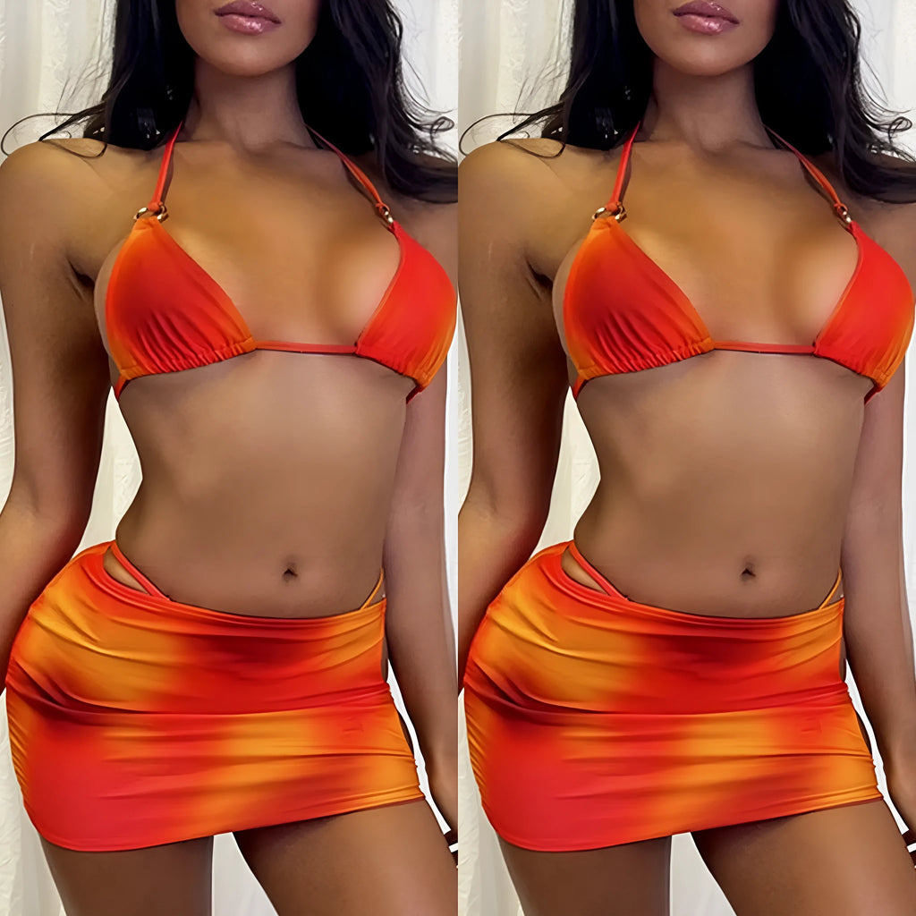 Tie-dye pattern three-piece swimsuit set with halter top, high-leg pants, and matching skirt