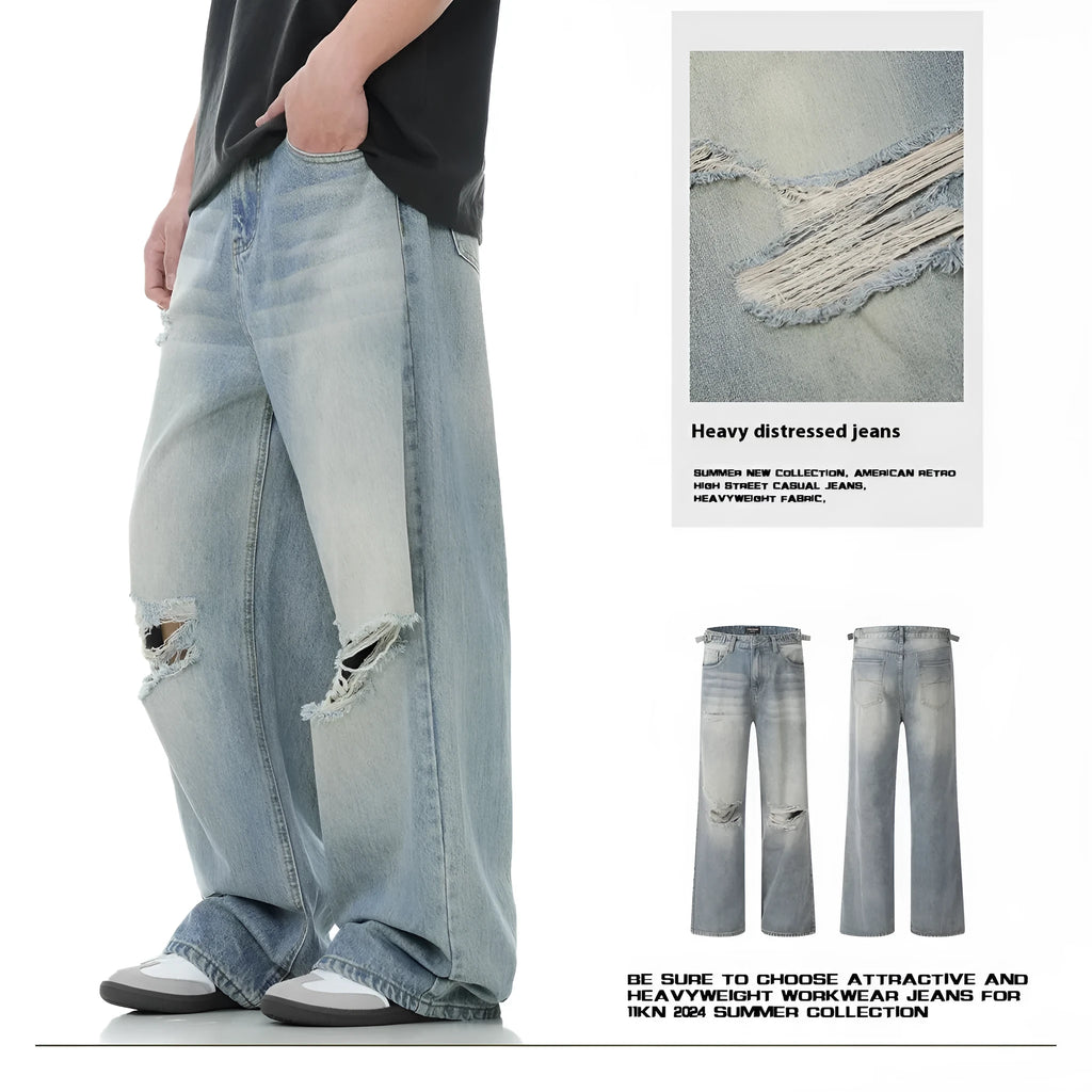 Men's blue straight-leg jeans with ripped details on the legs, showing a zipper fly.