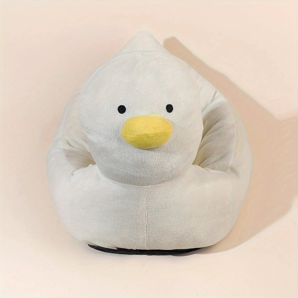 Blue duck-shaped fluffy pet bed for a small dog on a wooden floor.