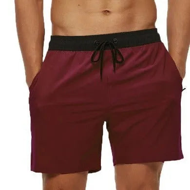 Men's blue polyester running shorts with a drawstring waist and a side headband pocket.
