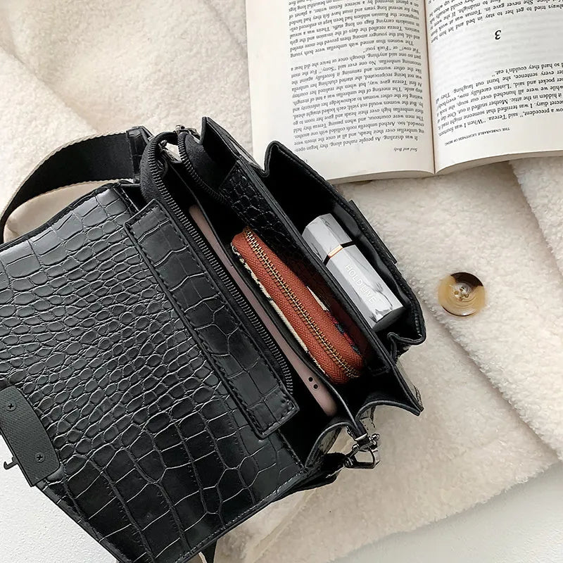 Vintage PU leather crossbody bag in black showing 20cm width and crossbody strap