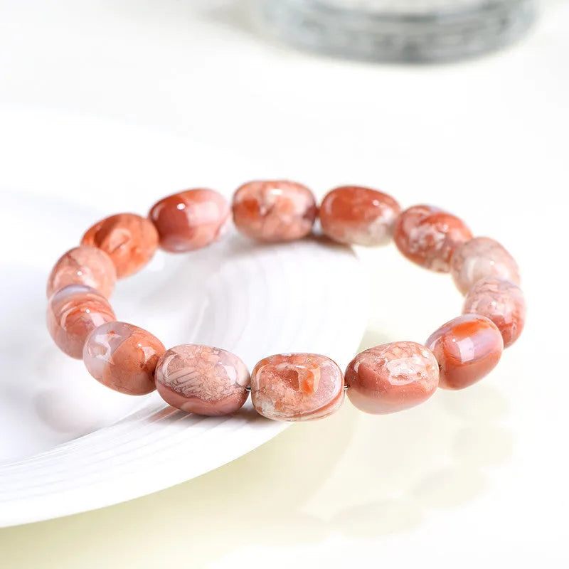 Natural cherry agate barrel bead bracelet with Ruyi pattern measuring 10x14mm