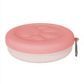 Portable dog food and water bowl with snack storage compartment in light pink colour