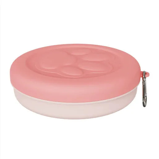 Collapsible portable silicone dog bowl in light green, shown with carrying strap.