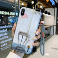 Rose floral pattern wrist strap iPhone case with detachable crossbody lanyard on iPhone 11