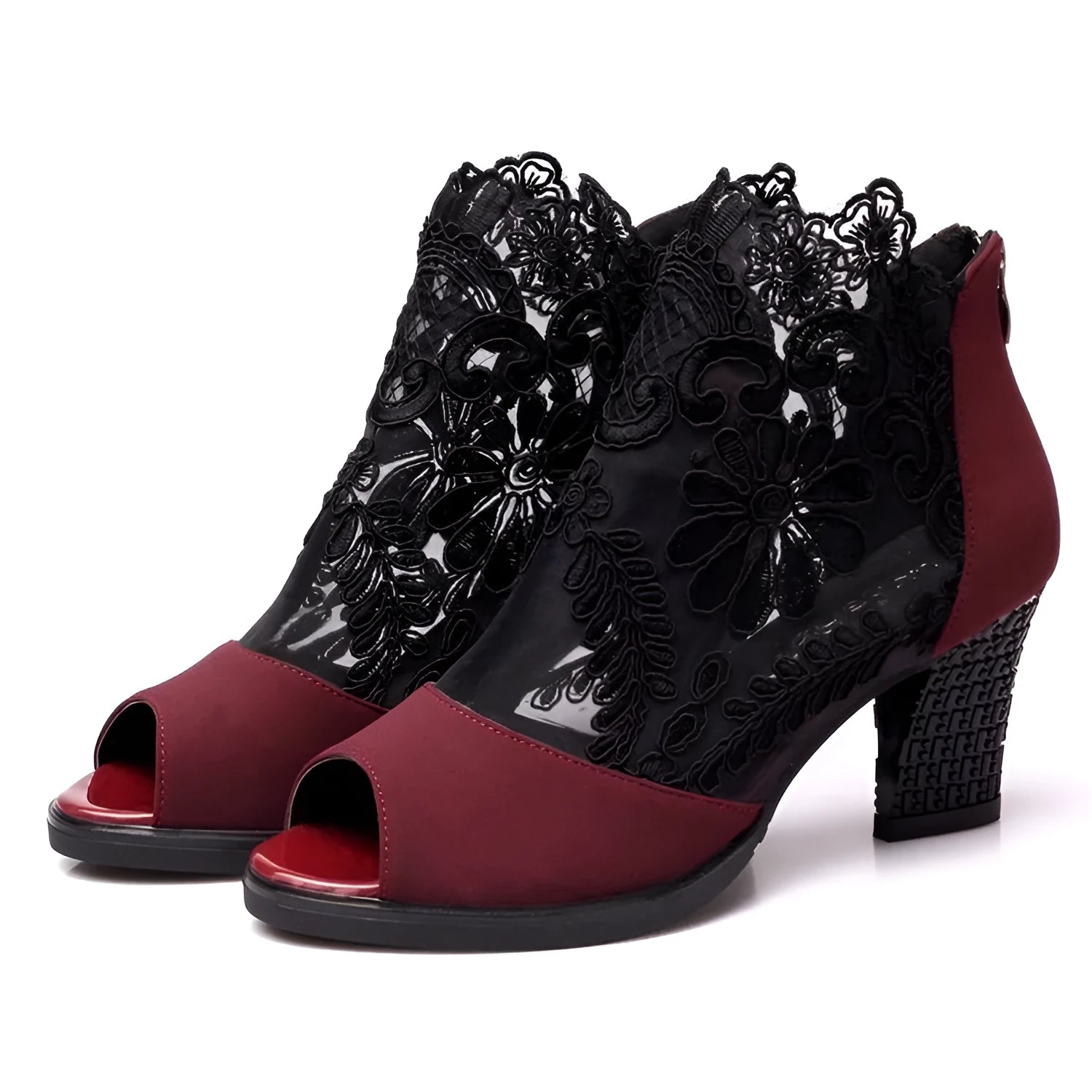 Black women's gladiator sandals with lace upper, square high heel, and side zip closure on a foot.