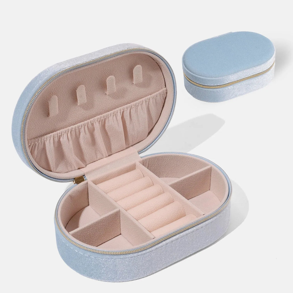 Oval velvet jewellery storage box in lake blue with soft flannel interior for ring and earring organisation.