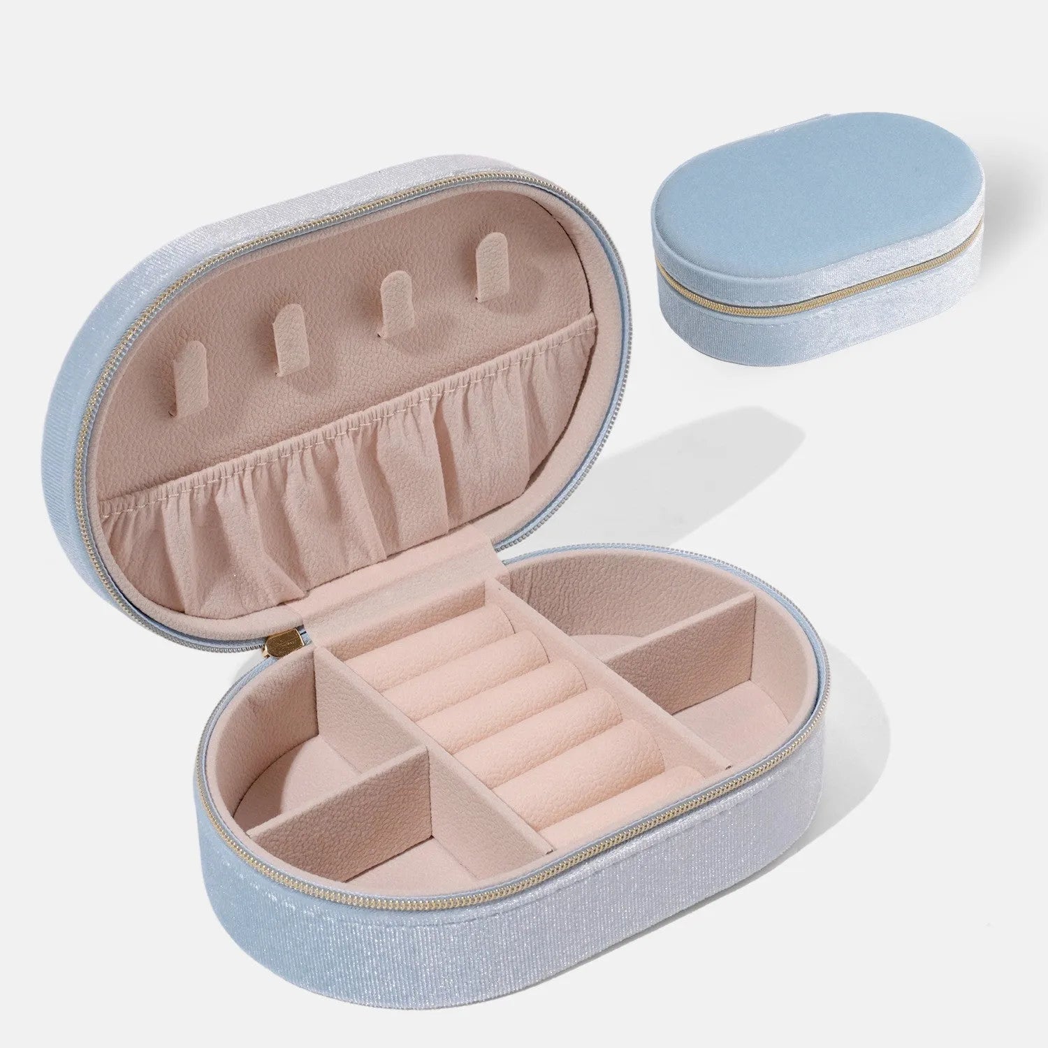 Oval velvet jewellery storage box in lake blue with soft flannel interior for ring and earring organisation.